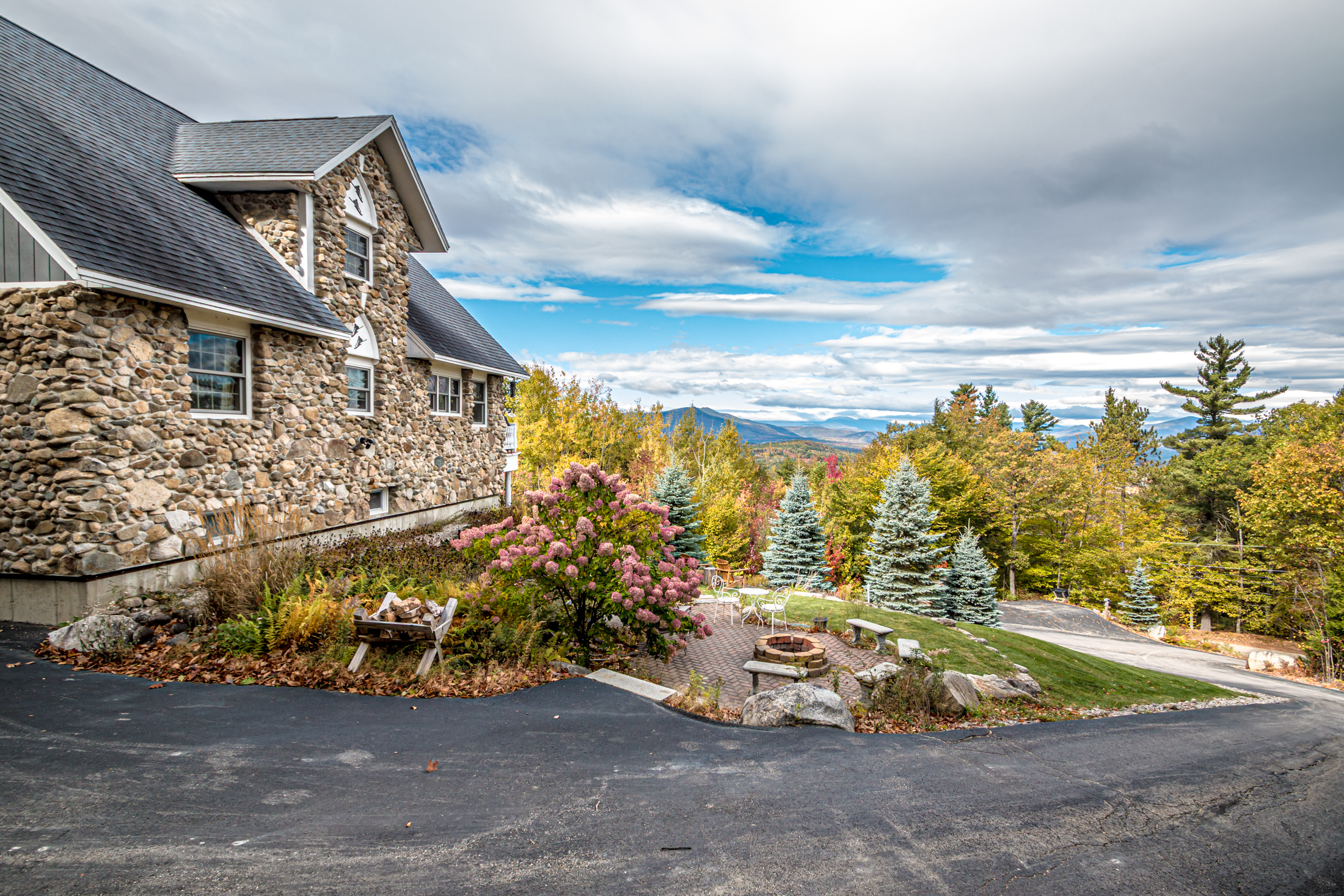 Stonewood Chalet framed by autumn trees